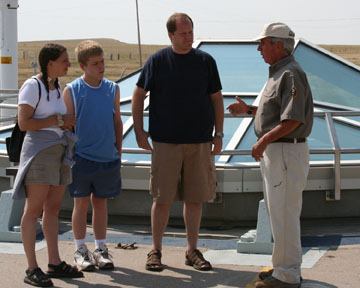 Park volunteer and fomer missileer Dennis Cabrera tells visitors about missile silo Delta-09.