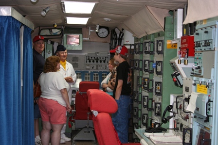 Visitors listen to former missileer Al Martens on an Open House tour