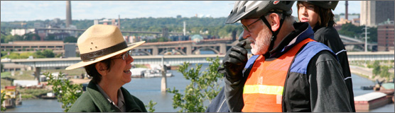Ranger talking with St. Paul Bike Classic participant.