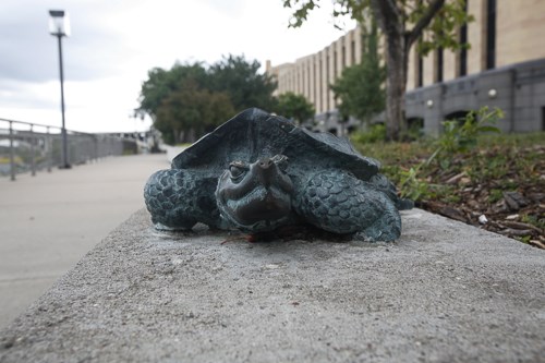 A small bronze statue of a snapping turtle.
