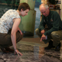 A ranger and a visitor looking at the Mississippi floor map.