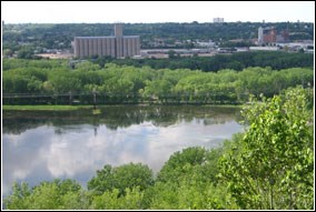 From high on a bluff, one can see views of the Mississippi River and wooded shorelines.