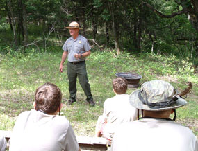 Ranger talks to a scout group about outdoor ethics.