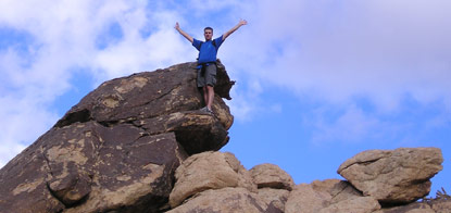photo of hiker on rocks
