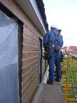 F. Repaired siding prior to painting
