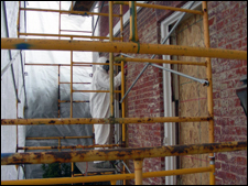 Thomas House windows and doors being rehabilitated