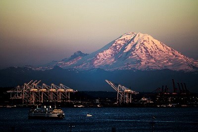 The massive hulk of the highest volcano in the contiguous states, Mount Rainier, dominates the eastern skyline for much of the Puget Sound region.