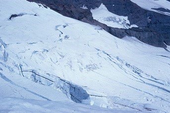 Close-up view of one of Mount Rainier's glaciers showing several gapping crevasses.