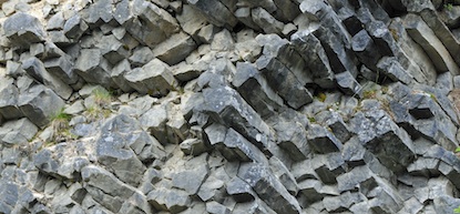 Hexagonal rock columns made of andesite form a columnar lava formation at Mount Rainier.