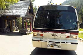 Shuttle bus awaits riders at historic Longmire gas station.