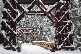 The Longmire Suspension Bridge covered with fresh snow.