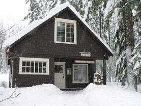 The Longmire Museum covered in snow.
