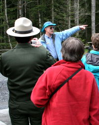 Interpretive volunteer Ron Warfield explains the pattern of recurring floods along Kautz Creek