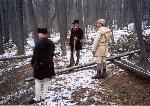 Enactors working on huts