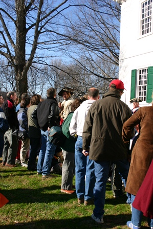 A group fo vistors listen to park ranger