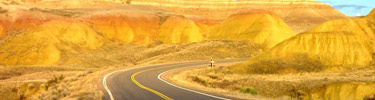 Brilliant colors of the setting sun at Yellow Mounds, Highway 240 in foreground