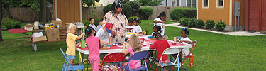 Students participating in art projects in the park.