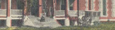 detail of postcard showing prison wagon by jail