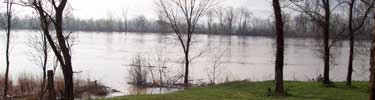high water in Arkansas River along walking trail