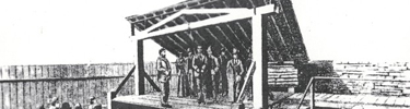 Cherokee Bill on scaffold with noose hanging above his head. His mother stands next to him.