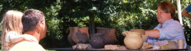 Visitors learn about prehistoric pottery during Archeology Day.