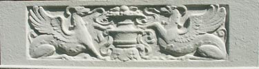closeup of Ozark flower box front-two griffings facing each other with an urn between them