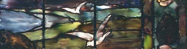 portion of Maurice stained glass, blue and green striated glass with white birds flying (gulls)