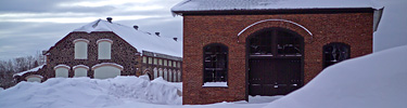Winter blankets the former industrial landscape around the C&H Man-Engine House.