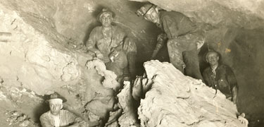 Miners with a piece of mass copper. Keweenaw NHP Archives photo.