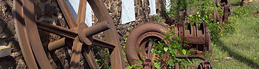 Relics from the mining era rest against a building on the Quincy Mine site.