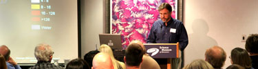 Speaker addresses an audience.