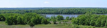 The Mississippi River flows past the prairies of Gray Cloud Island.