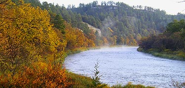 Fall colors along the river near Cornell Bridge