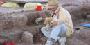 Scientist uncovers fossils at the Pig Dig Scientist uncovers fossils at the Pig Dig