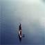 Overhead view of lone canoe on the river