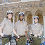 Rangers pose with bicycles in front of Central High School