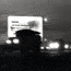 U.S. Army troops roll into Little Rock September 24, 1957 under a billboard reading