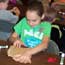 child at hands-on workshop