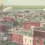 birds eye view of city with boats on river