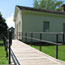 A wheelchair ramp leads to the historic Schoolhouse.