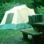 tent with corner of picnic table in foreground