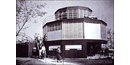 A 3 story round house stacked like a cake with windows all around it taken in 1933