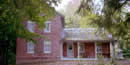 picture of a 2 story red brick farm house