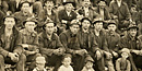 Miners pose outside the #5 Tamarack Mine shaft in this 1908 photograph by Adolph F. Isler. Keweenaw NHP Archives.