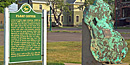 A piece of float copper sets on exhibit near the Calumet & Hecla general offices.