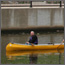 Man canoeing down the river.
