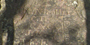 Early explorers carved their initials on this quartzite rock