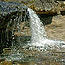 A small creek drops over a ledge at Miners Beach.