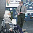 Park ranger assisting woman in wheelchair with information
