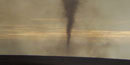 Dust devil created from spring prairie burns at the preserve.